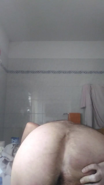 Davide the pig is in the bathroom, he undresses, he pees in a cut plastic bottle and I show his beautiful big ass. | Clip 1