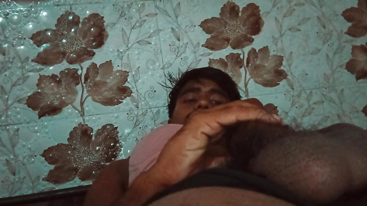 Massage of a big penis with black hair
