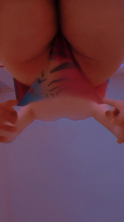 Woman in bikini caresses her own ass