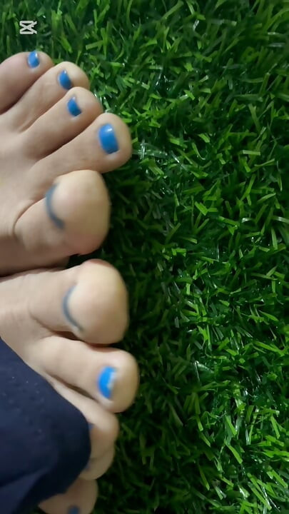 Dirty feet in grass
