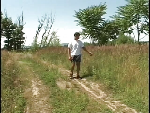 Hardcore gay action with two guys sucking and fucking in the middle of a field