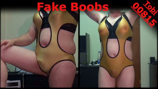 Fake boobs, posing in golden swimsuit, shaved body
