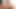 Brunette ladyboy in tight pink dress playing with her small