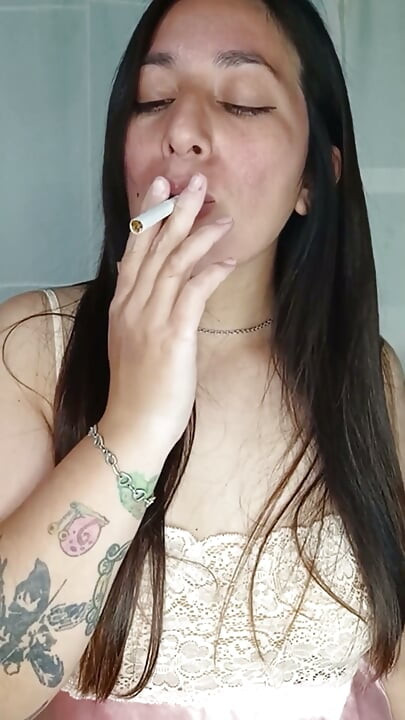 A Chubby Girl Smoking and Playing with Her Boobs