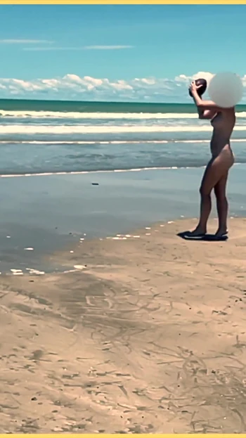 Jaw-dropping moment from "Wifey strips nude and plays with the football at the beach"