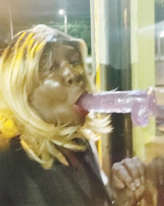 Sucking dildo in public