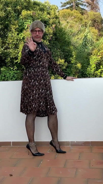 On my terrace in a dress and heel.