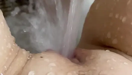 Oh she loves to masturbate with a stream of water until she orgasms