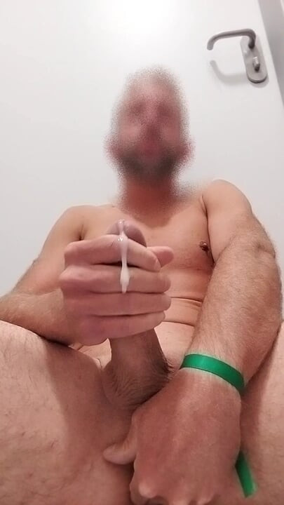 Hot man satisfies himself in the bathroom of a clinic.