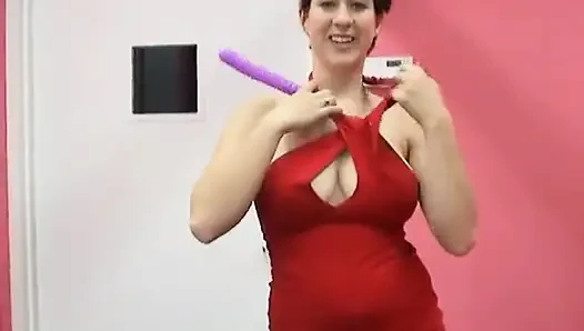 Teen brunette stuffs her pussy with a big sex toy on the bed