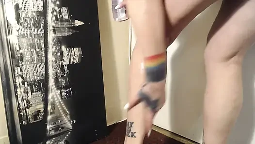 Oiled calves flexing calve muscle