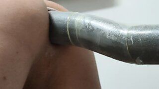 Close-up anal toying with dildo
