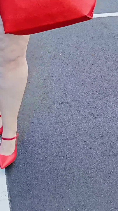 Beautiful Woman Walking Outdoors in  Parking Lot Showing off for Strangers