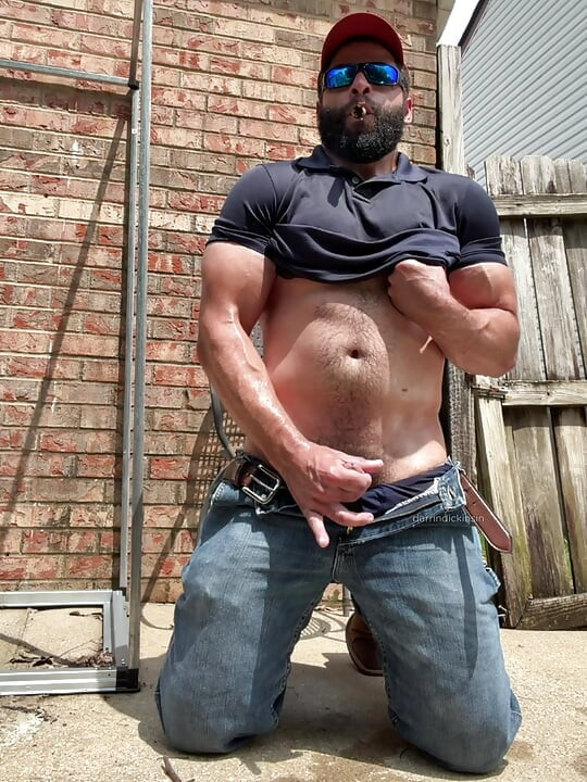 Booted Bearded Fella Cigar and Edge Out Back