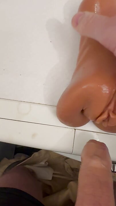 The guy jerks off and cums on his pocket vagina.