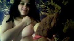 Busty Cynthia abusing teddy bear on cam