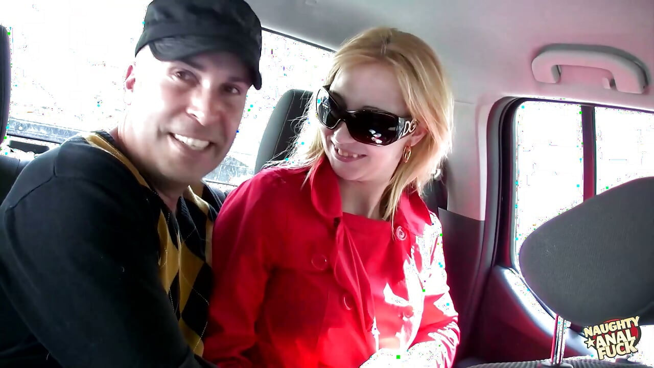 A blonde engages in oral sex in a vehicle and thereafter has anal intercourse outside.