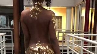 African Girl Wearing Gold Walks