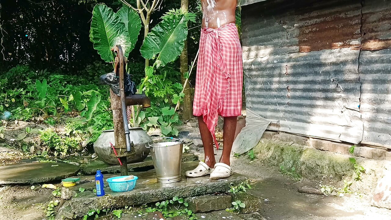 Desi young man bath Open place.