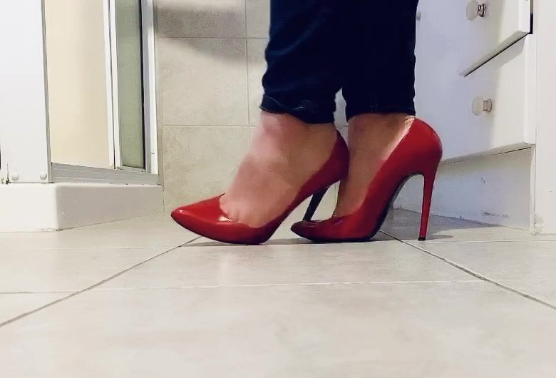 Playing in her red stilettos
