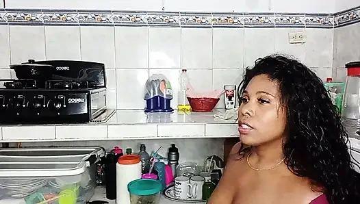 Brunette girl gives cream pie in the kitchen