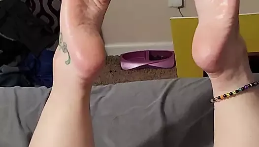 Milf enjoying a toy with her feet up after a foot rub