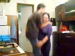 Woman carries her boy toy and kisses him