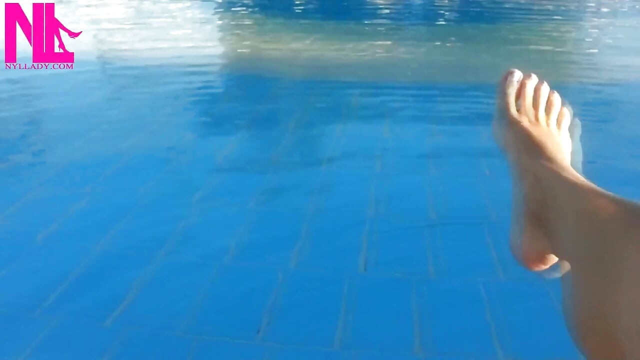 Barefoot Dangling in Swimming Pool Water