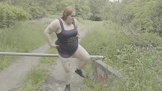 Redhead BBW Pisses Next to a Gate
