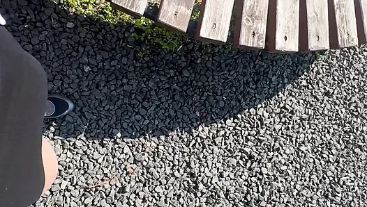 Sexy hot stepmom is horny and caresses herself on a park bench