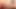 Slender ladyboy in colorful dress pulls out her shaved cock