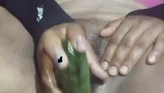 Today, Indian bhabhi quenched her desire by inserting a cucumber into her pussy.