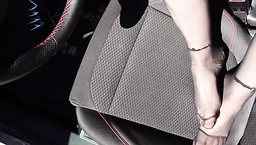 Feet of Nylonjunge in Pantyhose in Car