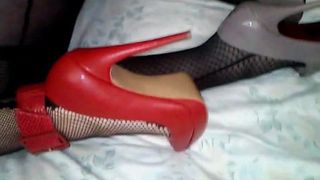 Girl in fishnets and red heels fucked by crossdresser