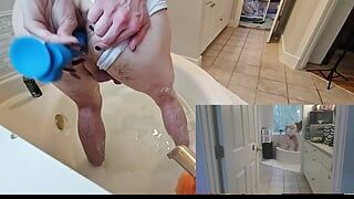 Playing with a dildo in the tub