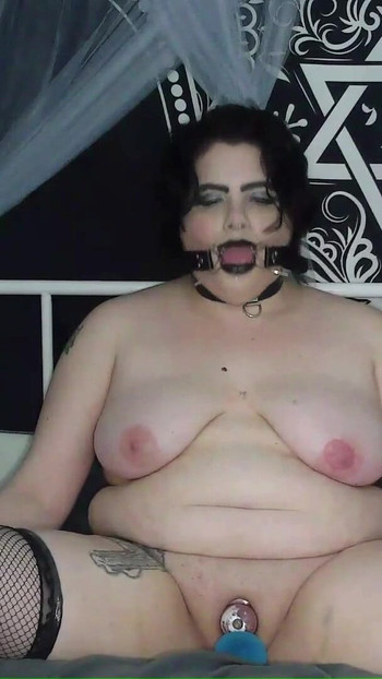 Stunning moment from "Desperate BBW Goth Bitch Adama Daat Pumps and Fucks Her Swollen Pussy in a Spider Gag"