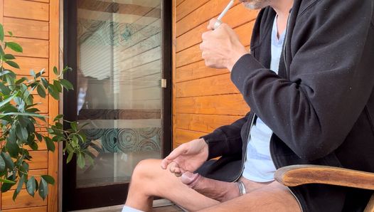 Smoke some cigarettes on my balcony jerkoff my big dick