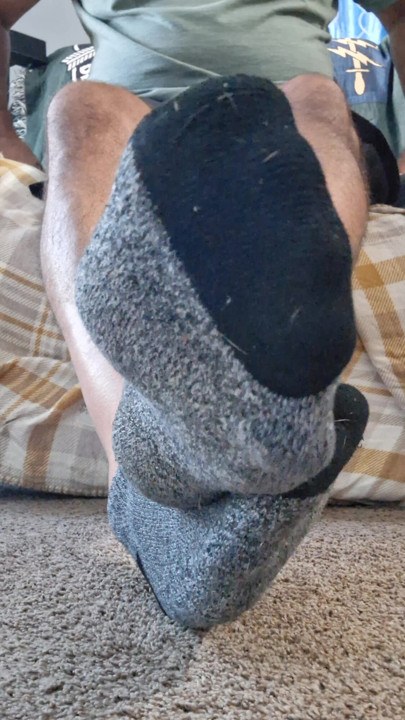 Taking off my socks and rubbing my soft bare feet and soles all over your face and tool