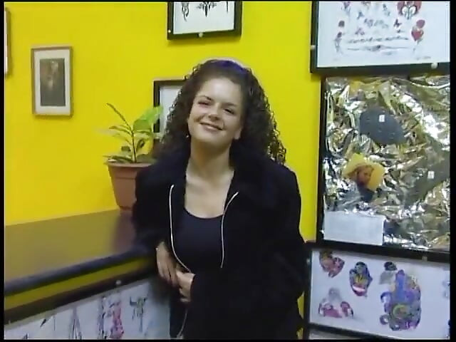 Fabulous brunette with curly hair wants a new tattoo