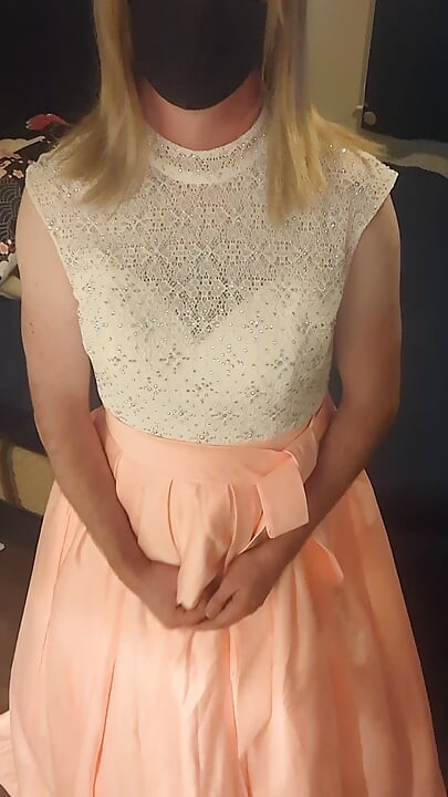 Enjoying a cuteute pink satin prom dress in bed