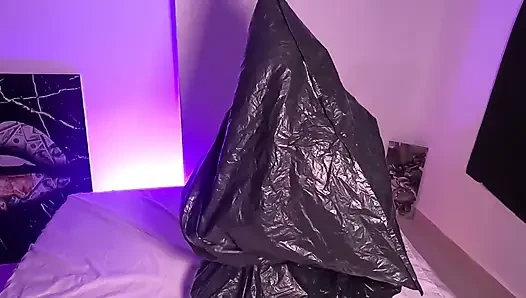 Girl in Garbage Bag Plays with Her Breath