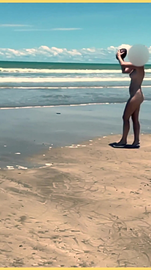 Wifey strips nude and plays with the football at the beach | Clip 1