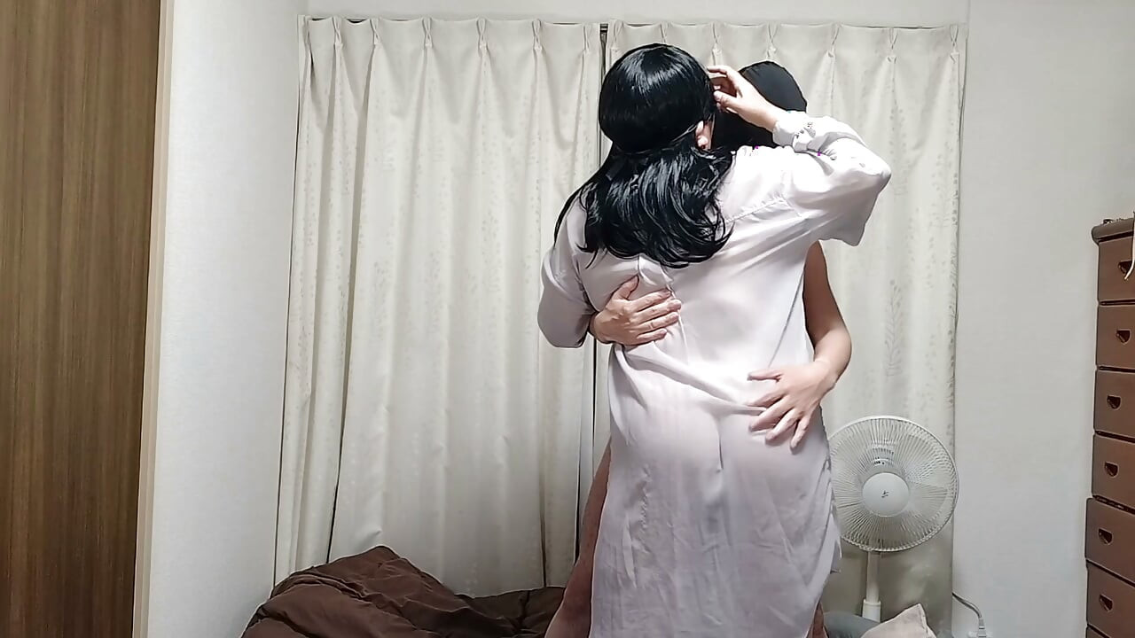 Chubby, busty mature wife: With just a sheer shirt, she keeps caressing her K-cup big breasts.