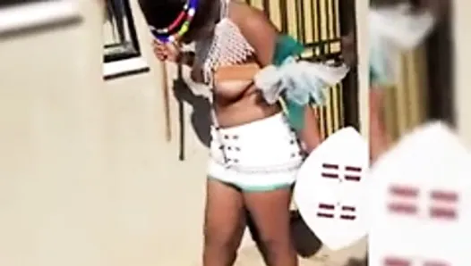 Topless African shy girl is filmed by some guy