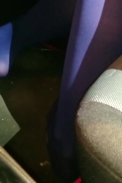 Dangling in Blue Pantyhose and Blue Flats on a Gas Station