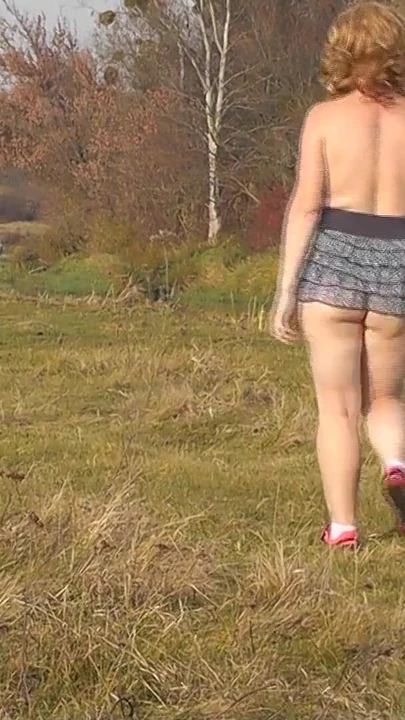 Powerful moment from "Naked in public. Outdoors sexy woman Milf without panties and bra playing sports Outside. Natural"