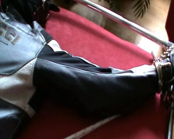 Bikerslave is restrained to the Frame