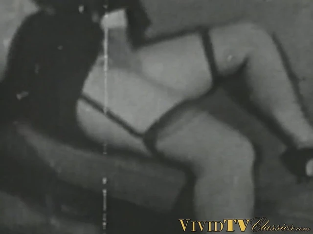 Black and white vintage video of lady sucking her lover