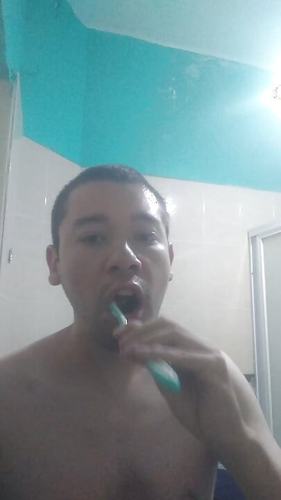 Man washes his face