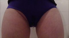 Filly pisses in her sexy purple spandex hotpants!